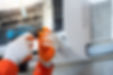 Hands Repairing Air Conditioner